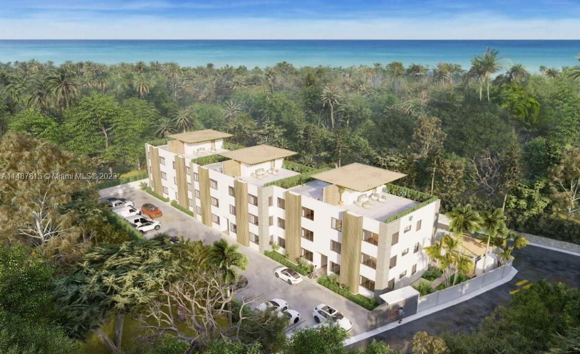 This is a rendering of a multi-story apartment building surrounded by trees near the ocean — 2223 Salome Urena # 201, DR, DR