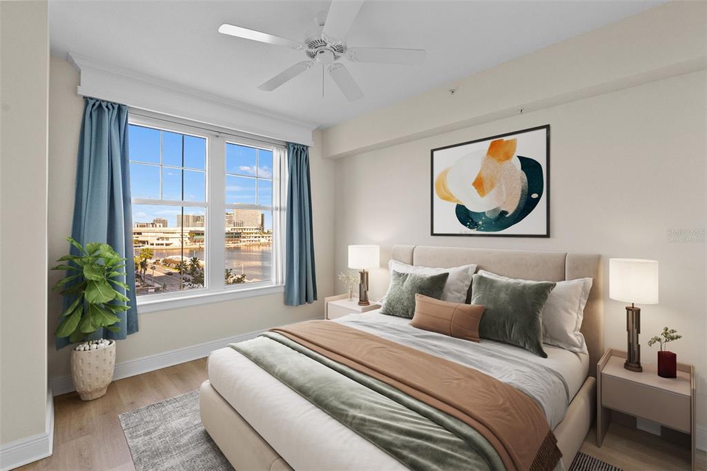 A bedroom features a queen bed, two nightstands, a ceiling fan, and a waterfront view — 345 BAYSHORE BOULEVARD UNIT 710, TAMPA, FL