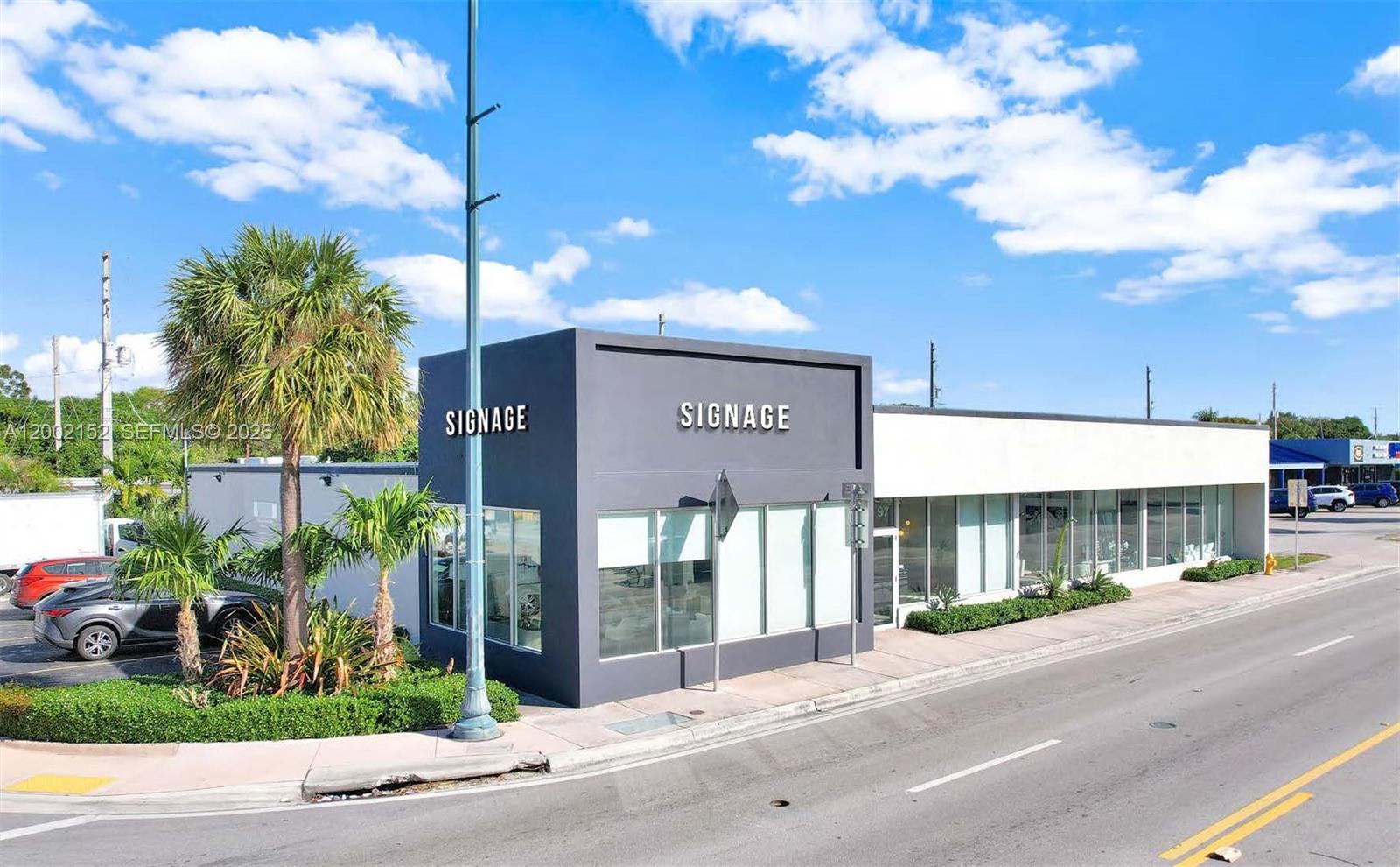 A modern commercial building with a dark gray corner section and white side walls — 4797 SW 8th St, Miami FL 33134, MIAMI, FL