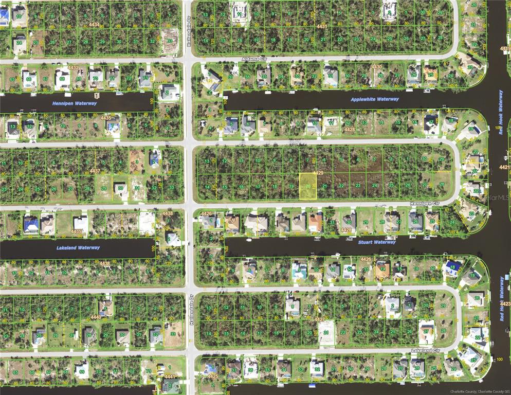 This is an aerial map showing residential lots and waterways in a suburban neighborhood — 15625 HENNIPEN CIRCLE, PORT CHARLOTTE, FL