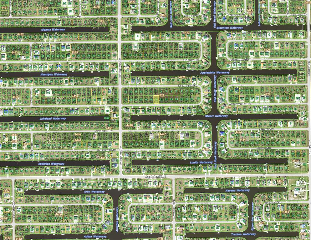 This is an aerial map of a residential neighborhood with houses and waterways — 15625 HENNIPEN CIRCLE, PORT CHARLOTTE, FL