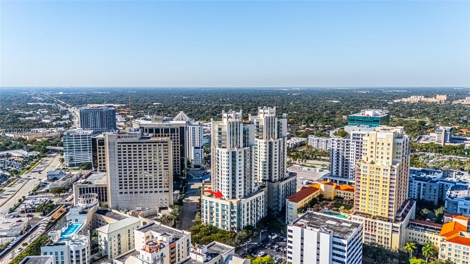 An aerial view shows a tall residential building with a red arrow pointing toward it — 9055 SW 73 CT # 809, Miami FL 33156, MIAMI, FL