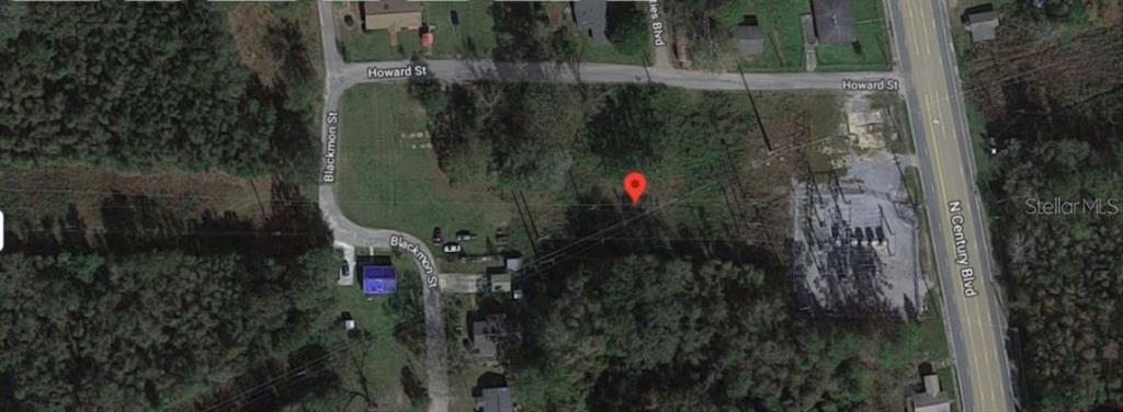 An aerial map view shows a vacant lot bordered by Howard Street and North Century Boulevard — HOWARD STREET, CENTURY, FL