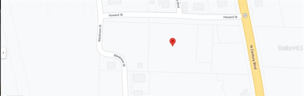 This is a map showing a vacant lot marked with a red pin — HOWARD STREET, CENTURY, FL