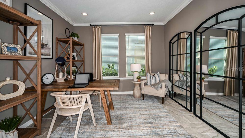 A home office features a wooden desk, shelving, an armchair, and large arched wall mirrors — 6917 PRAIRIE OAK WAY, NOKOMIS, FL
