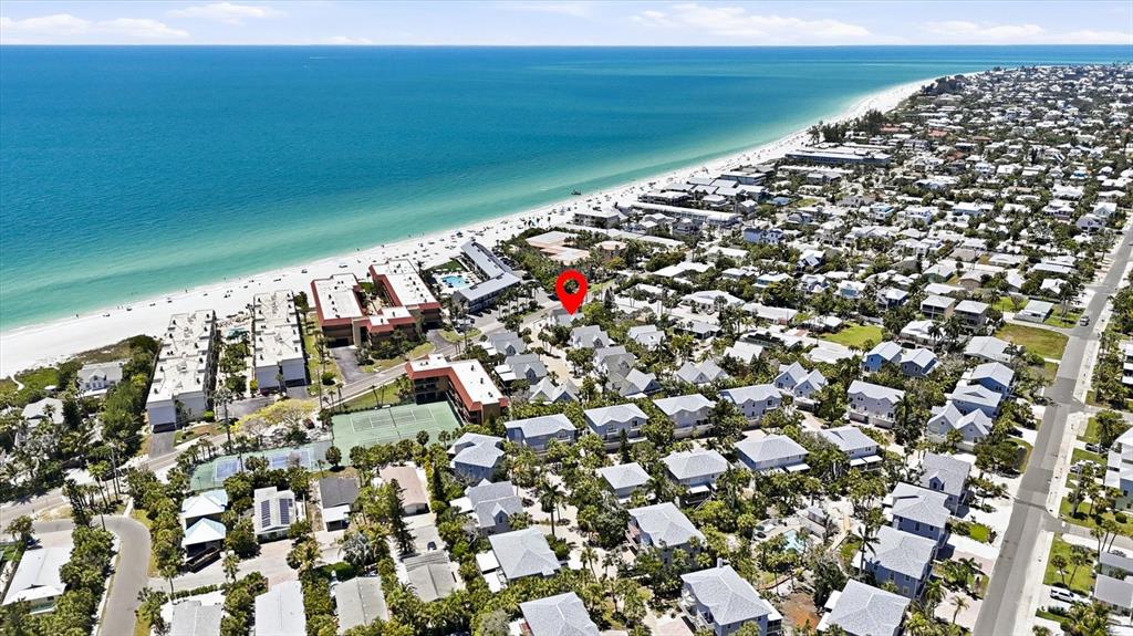 This aerial view shows a coastal neighborhood with a red location pin — 6325 GULF DRIVE, HOLMES BEACH, FL