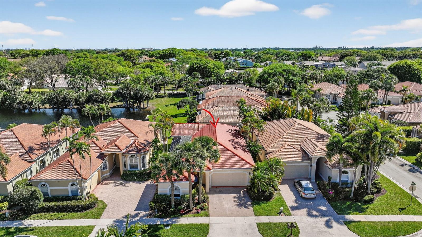 An aerial view shows a suburban house with a red tile roof and palm trees — 5176 Ventura Drive # 5176, Delray Beach FL 33484, DELRAY BEACH, FL