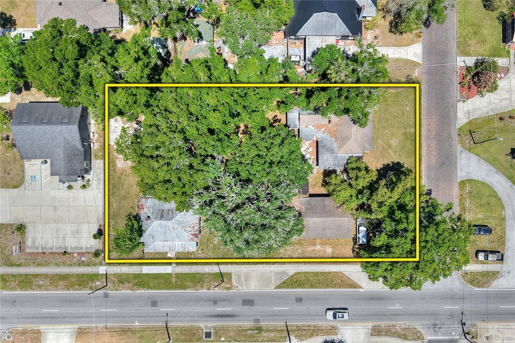 An aerial view shows a rectangular lot containing two buildings and large trees — 503 MERRIN STREET, PLANT CITY, FL