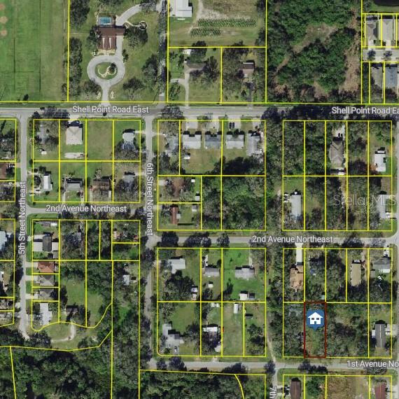 This is an aerial map showing property lot lines and a highlighted parcel — 704 1ST AVENUE NE, RUSKIN, FL
