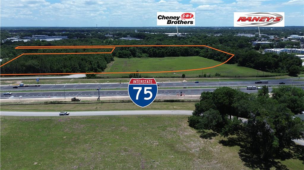 An aerial view shows a large, undeveloped plot of land adjacent to Interstate 75 — NW 37TH STREET, OCALA, FL