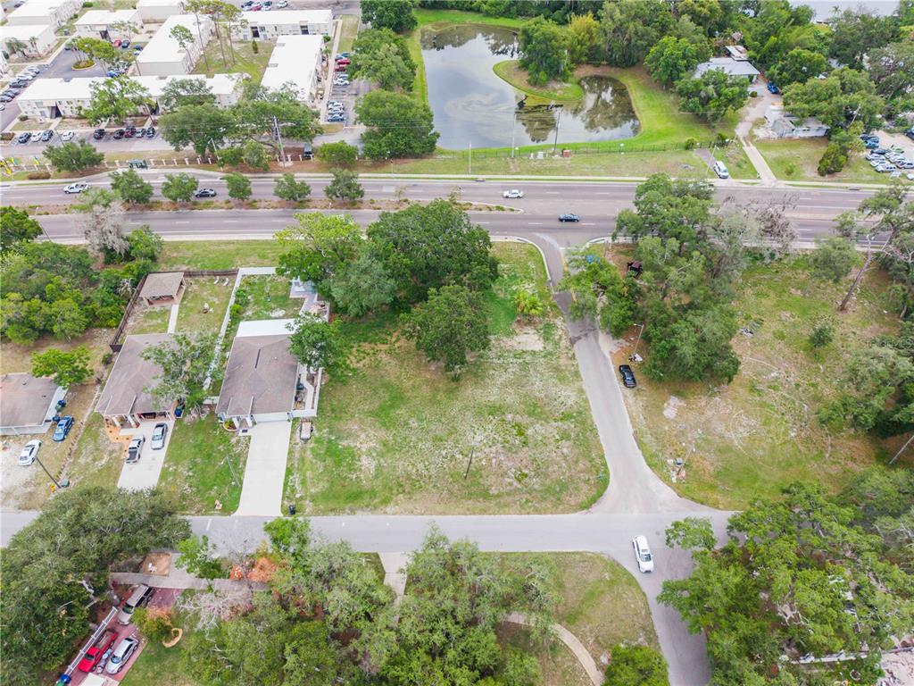 An aerial view shows a vacant lot situated between a residential street and a highway — 7514 N 40TH STREET, TAMPA, FL
