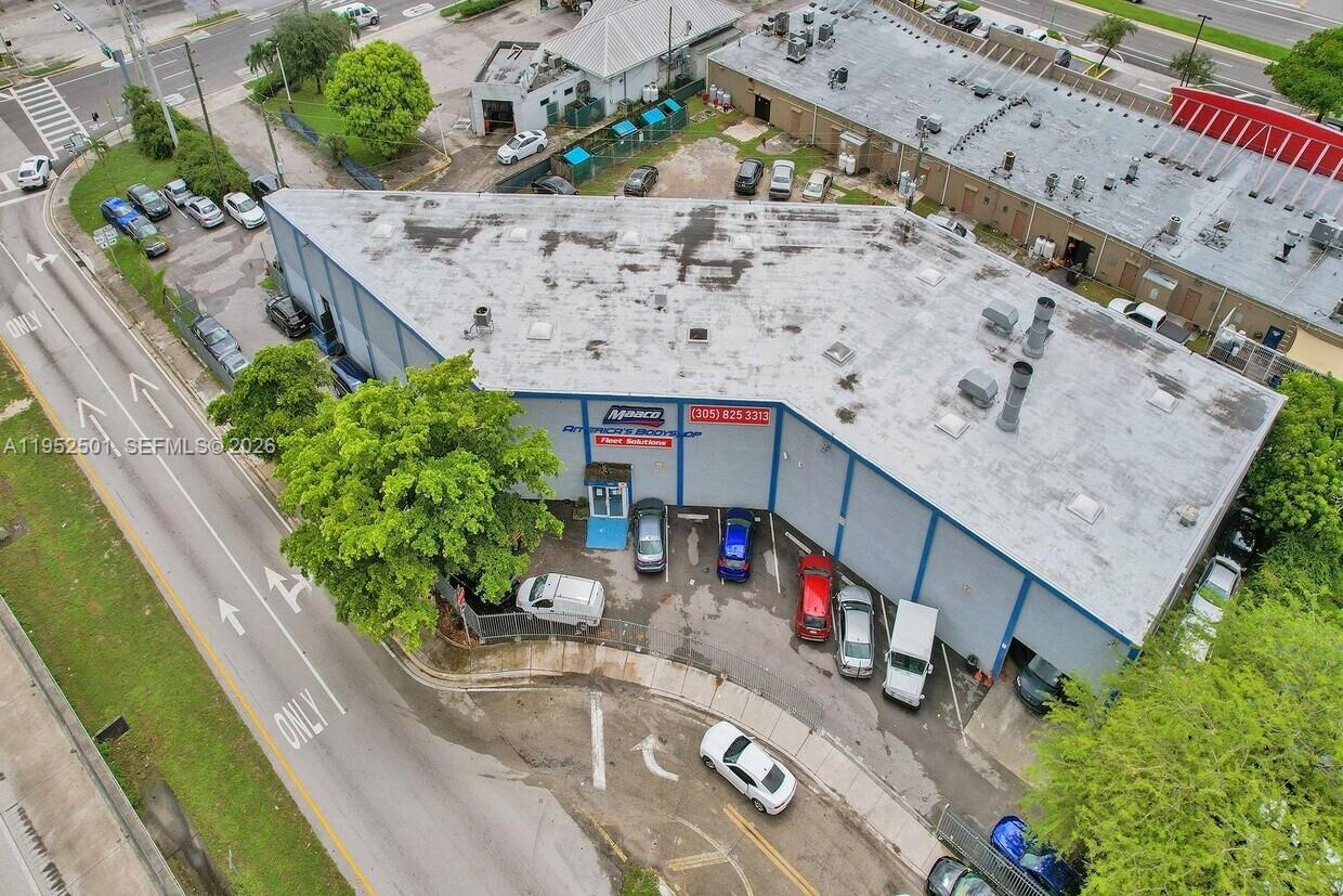 An aerial view shows a commercial building with a Maaco sign and a parking lot — 660 NW 137th St, North Miami FL 33168, NORTH MIAMI, FL