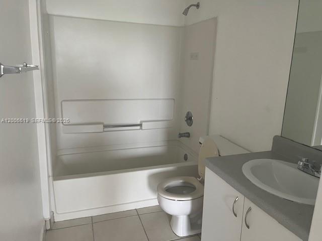 A bathroom features a white bathtub-shower combination, a toilet, and a vanity with a sink — 15231 SW 80th St # 503, Miami FL 33193, MIAMI, FL