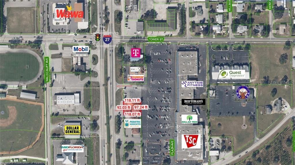 This aerial map shows a commercial shopping center and surrounding businesses near a highway intersection — 123 US 27 N, LAKE PLACID, FL