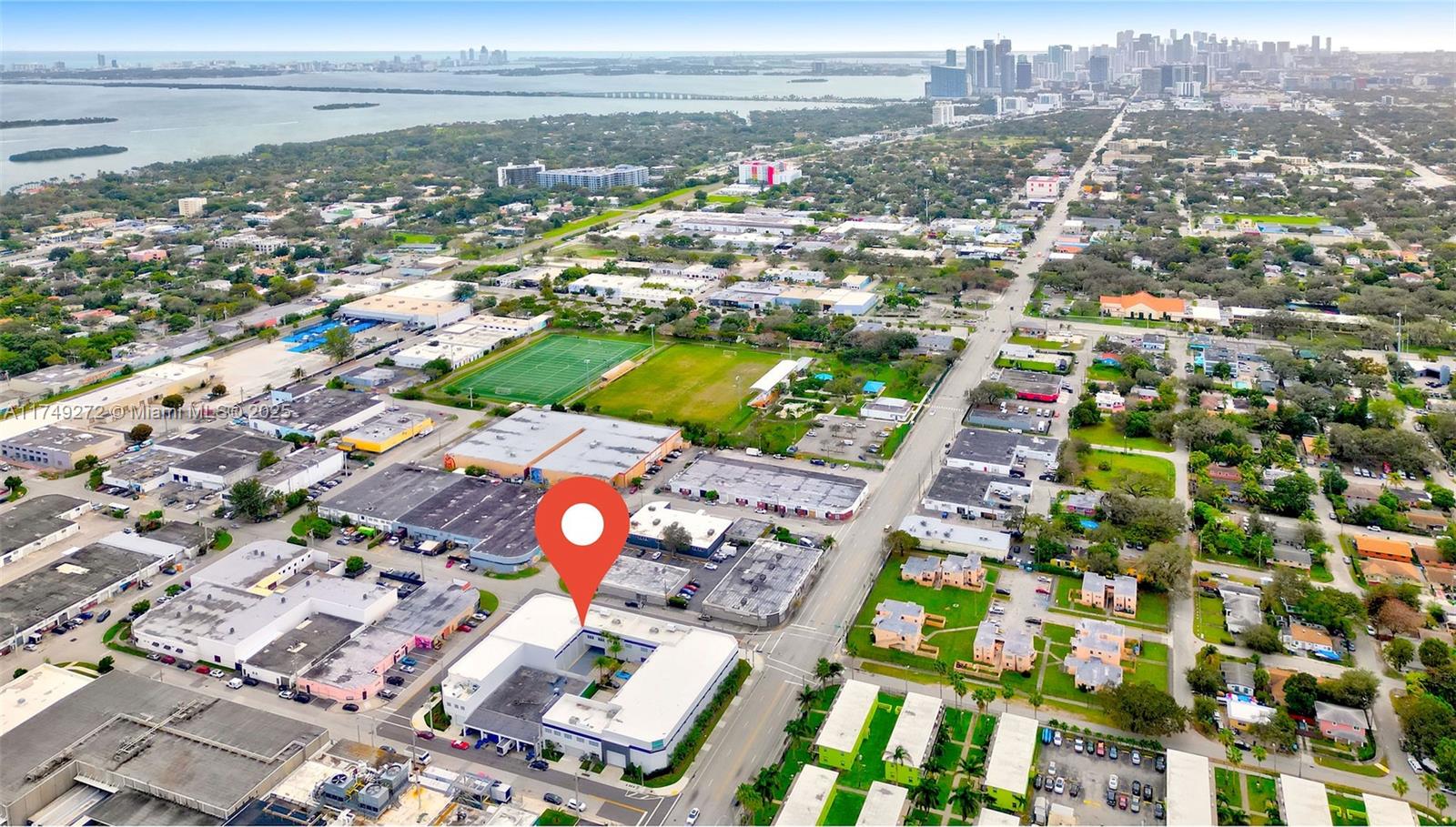 An aerial view shows a commercial building with a red location pin in Miami — 235 NE 67th St # 3, Miami FL 33138, MIAMI, FL