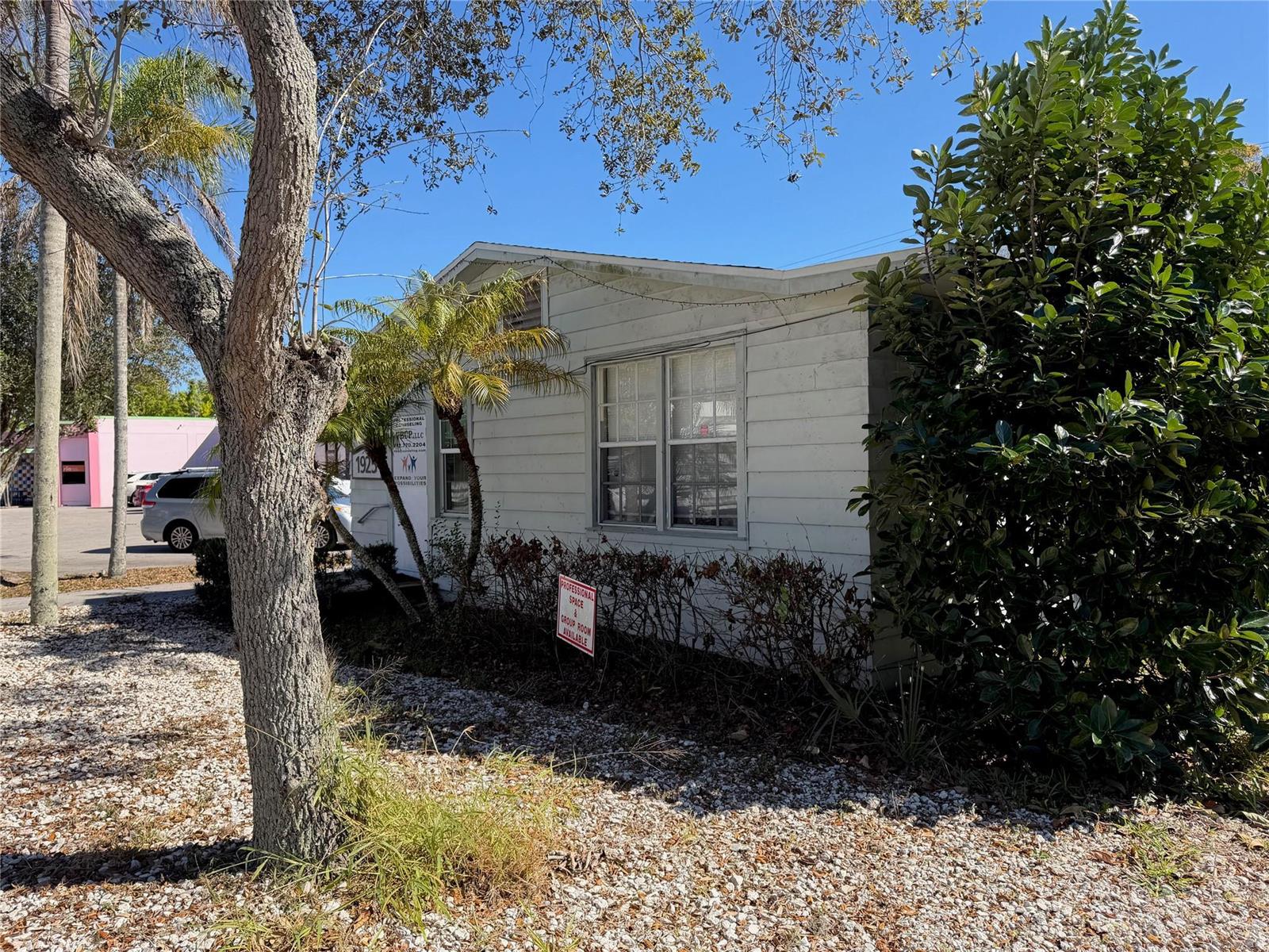 A white, single-story building with a gravel yard and a small sign in front — 1925 20th Street, Vero Beach FL 32960, VERO BEACH, FL