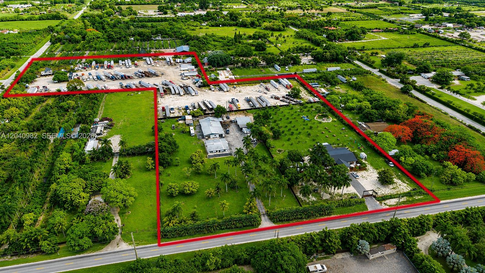 An aerial view shows a large property with a truck yard, buildings, and green space — 19790 SW 136th St, Miami FL 33196, MIAMI, FL