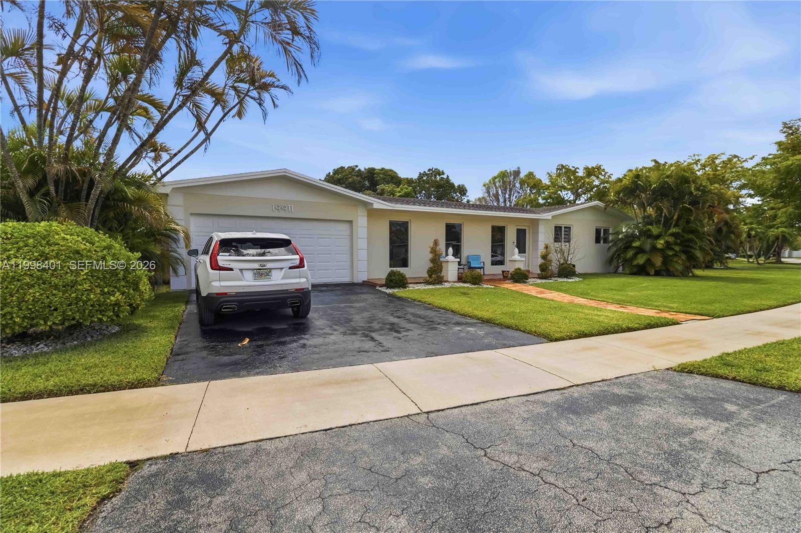 An aerial view shows a single-story house with a pool and a fenced backyard — 19911 SW 84th Ave, Cutler Bay FL 33189, CUTLER BAY, FL