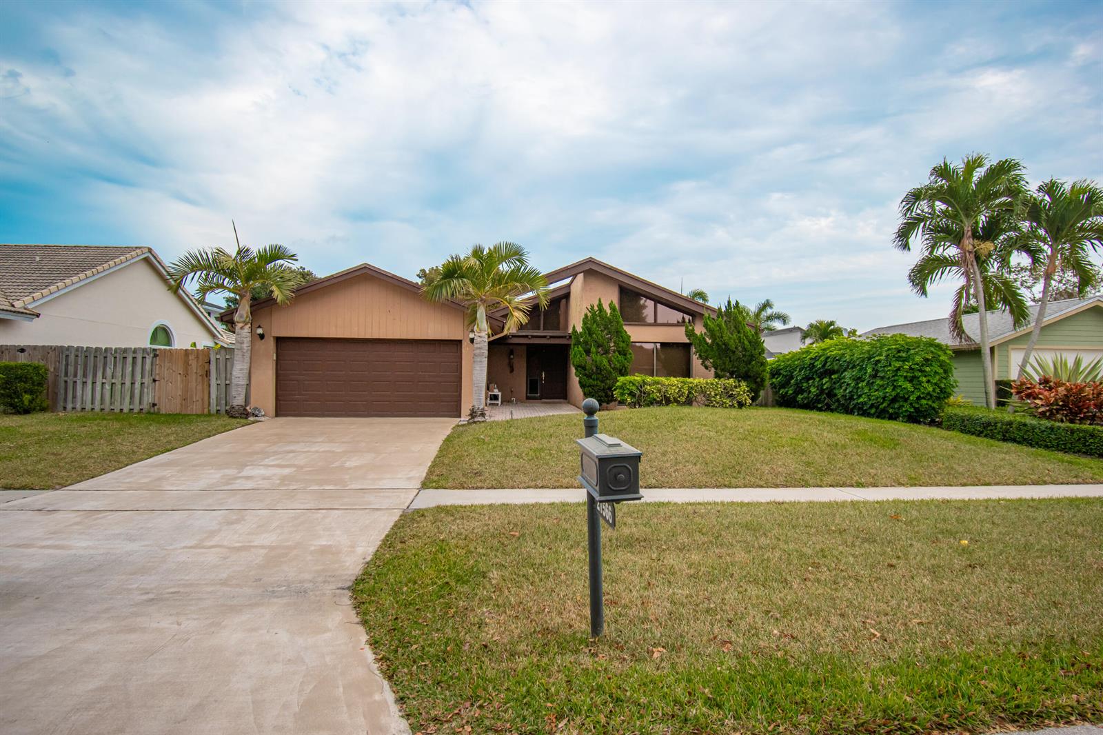 A single-story house with a brown garage, palm trees, and a front lawn — 21566 Arbor Way, Boca Raton FL 33433, BOCA RATON, FL