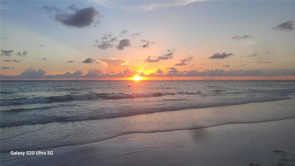 A sunset view over the ocean with waves washing onto a sandy beach — 13 SEAWARD CIRCLE, PLACIDA, FL