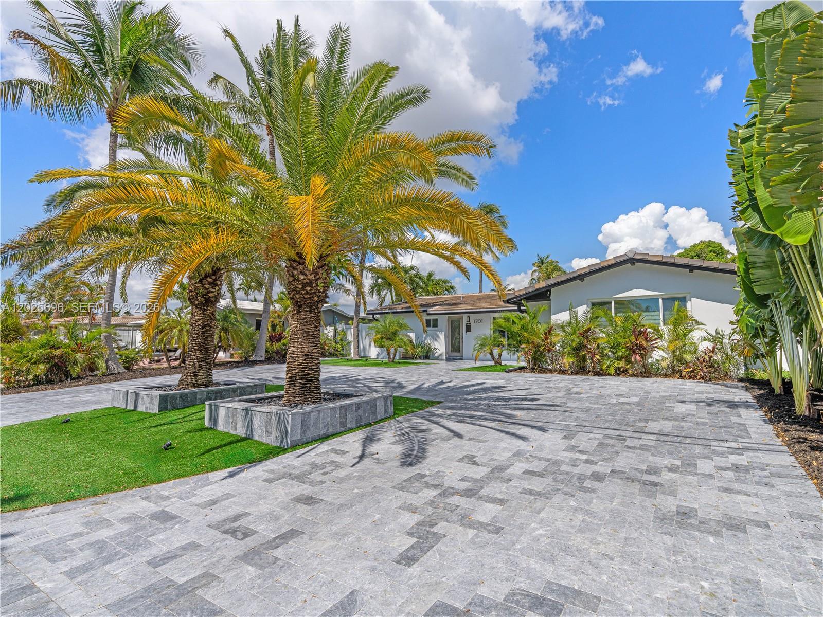 A single-story house with a paved driveway and palm trees in the front yard — 1701 SW 3rd Ave, Pompano Beach FL 33060, POMPANO BEACH, FL