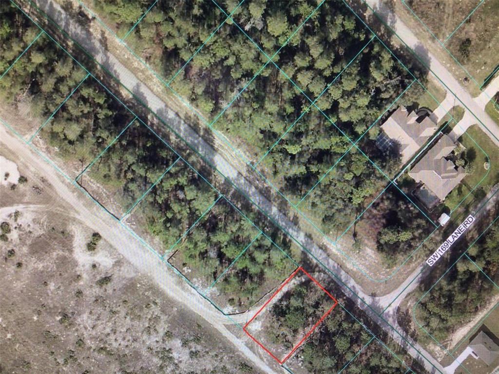 This is an aerial map showing a vacant, wooded lot outlined in red — 0 SW 44 CIRCLE, OCALA, FL