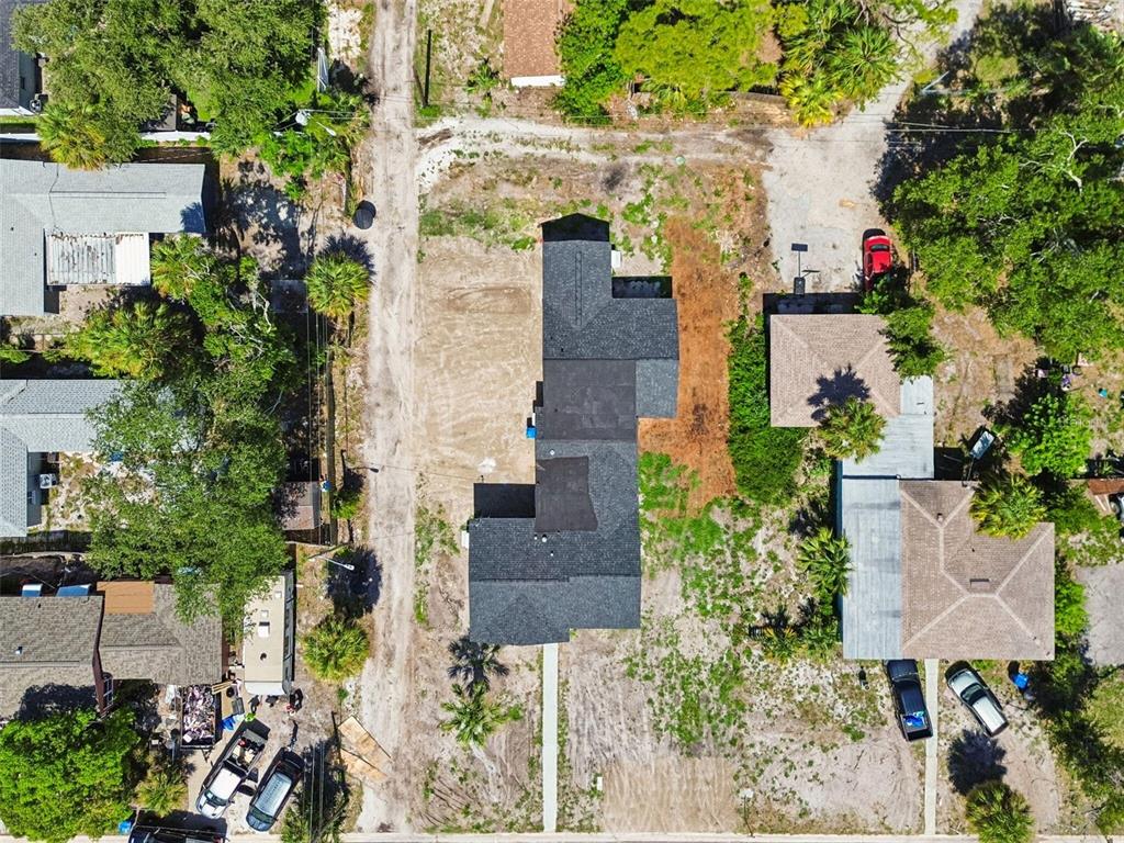 An aerial view shows a house with a dark roof situated on a large lot — 4125 GROVE, ST PETERSBURG, FL