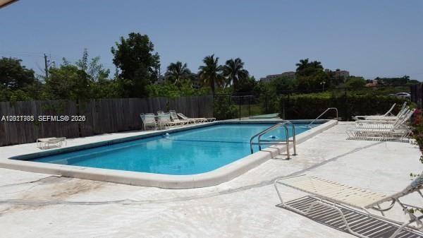 An outdoor rectangular swimming pool is surrounded by a concrete deck and lounge chairs — 500 SW 2nd Ave # 2150, Boca Raton FL 33432, BOCA RATON, FL