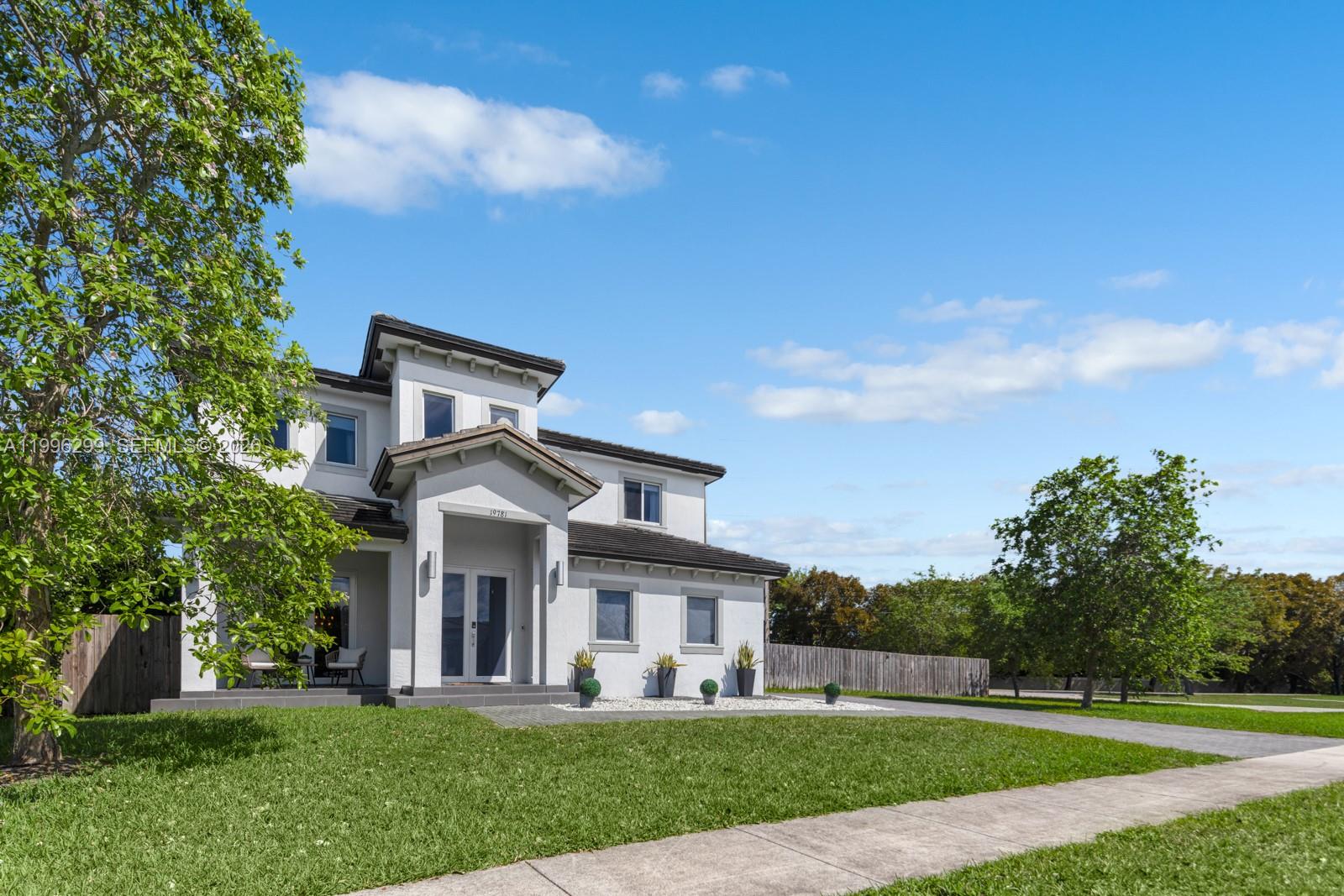 A two-story house with a white stucco exterior and a dark shingled roof — 19781 SW 84th Ct, Cutler Bay FL 33189, CUTLER BAY, FL