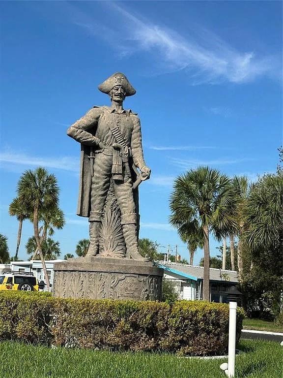 A large statue of a pirate stands outdoors in front of palm trees and buildings — 4851 W GANDY BOULEVARD UNIT B5L37, TAMPA, FL