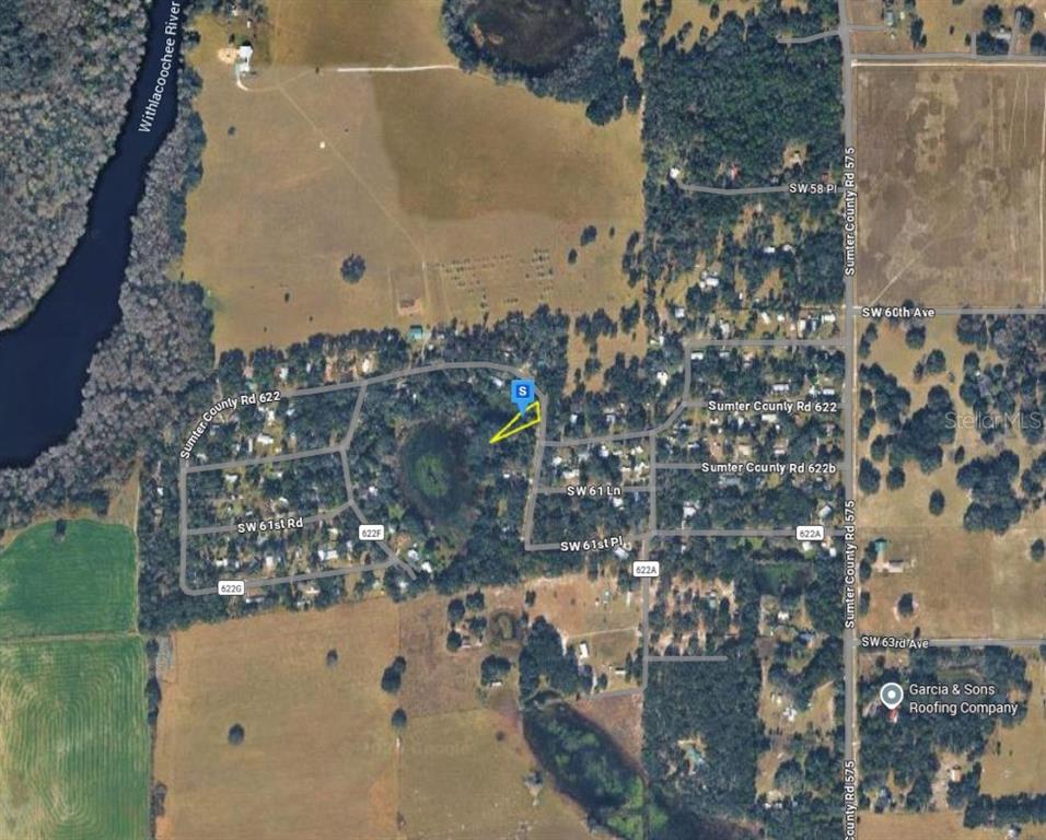 This is an aerial map view showing a highlighted property lot in a rural area — 9111 CR 622, BUSHNELL, FL