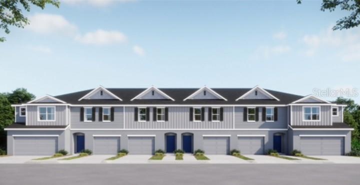 A digital rendering of a multi-unit townhouse building with gray siding and multiple garage doors — 32107 EASTERN REDBUD BRANCH, SAN ANTONIO, FL