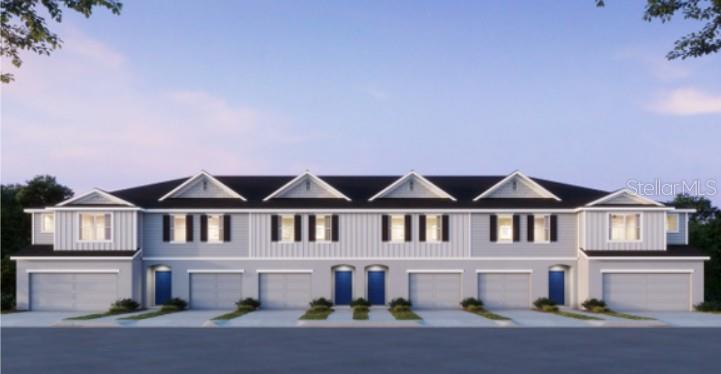 A digital rendering of a multi-unit townhouse building with light gray siding and blue doors — 32107 EASTERN REDBUD BRANCH, SAN ANTONIO, FL