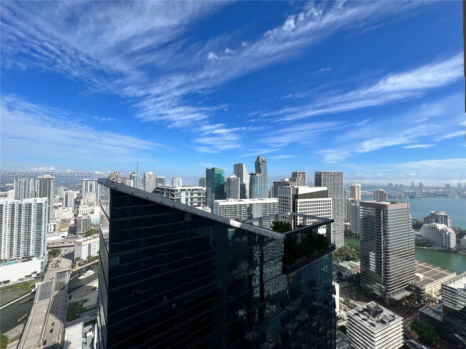 An elevated view of the Miami skyline featuring various high-rise buildings and a waterfront — 801 S Miami Ave # 5309, Miami FL 33130, MIAMI, FL