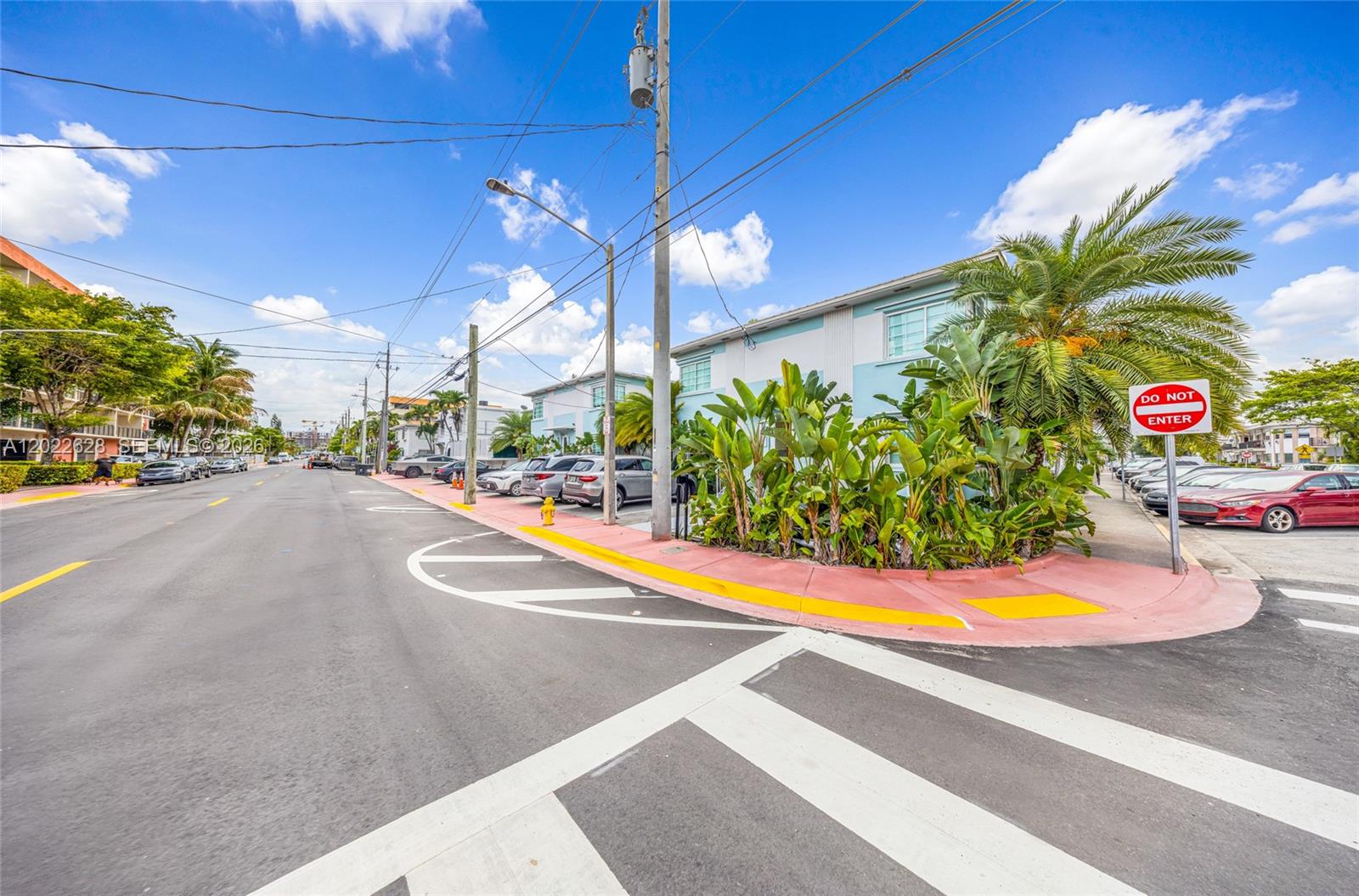 A street view shows a multi-story building with palm trees and a parking lot — 7830 Abbott Ave # 25, Miami Beach FL 33141, MIAMI BEACH, FL