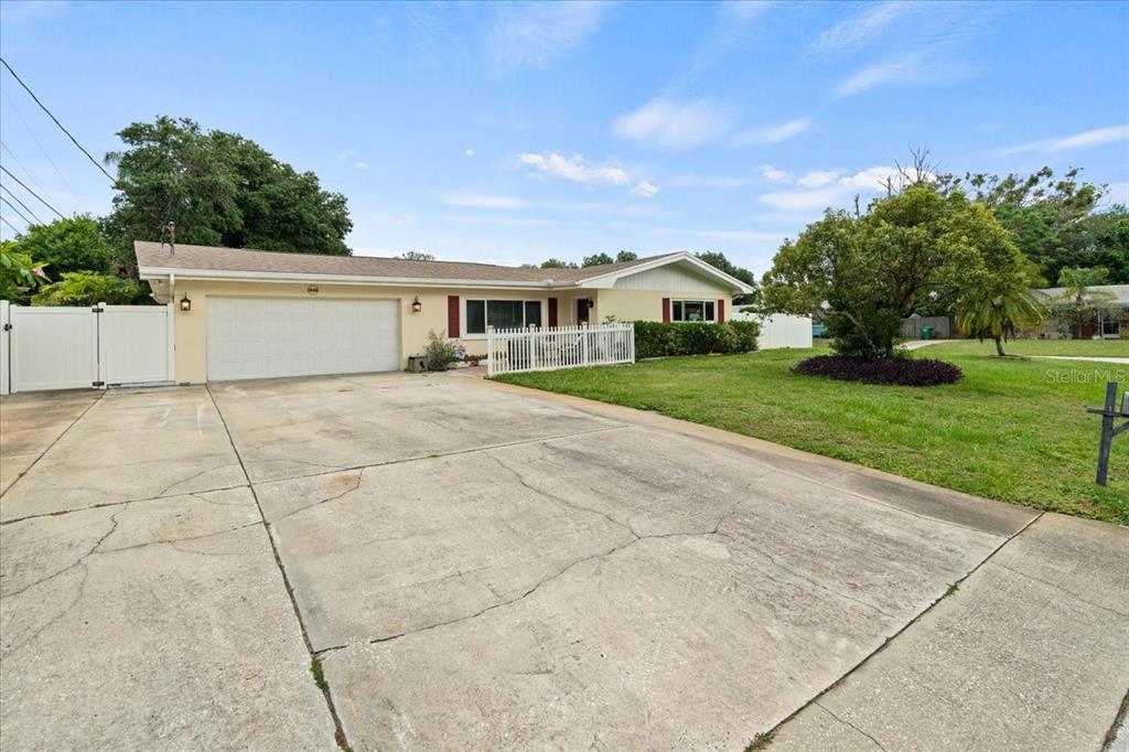 A single-story house with a two-car garage and a concrete driveway — 1560 BEL KEENE DRIVE, CLEARWATER, FL