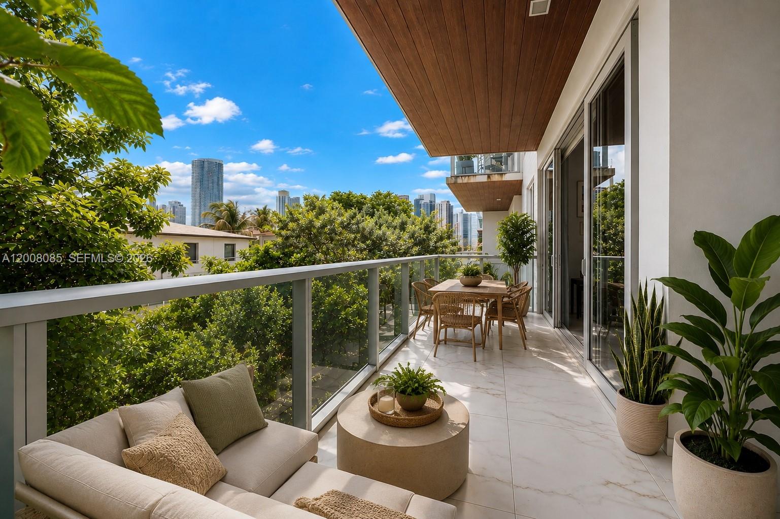 A living room features marble floors, a sliding glass door to a balcony, and wall art — 545 SW 11th St # 208, Miami FL 33129, MIAMI, FL
