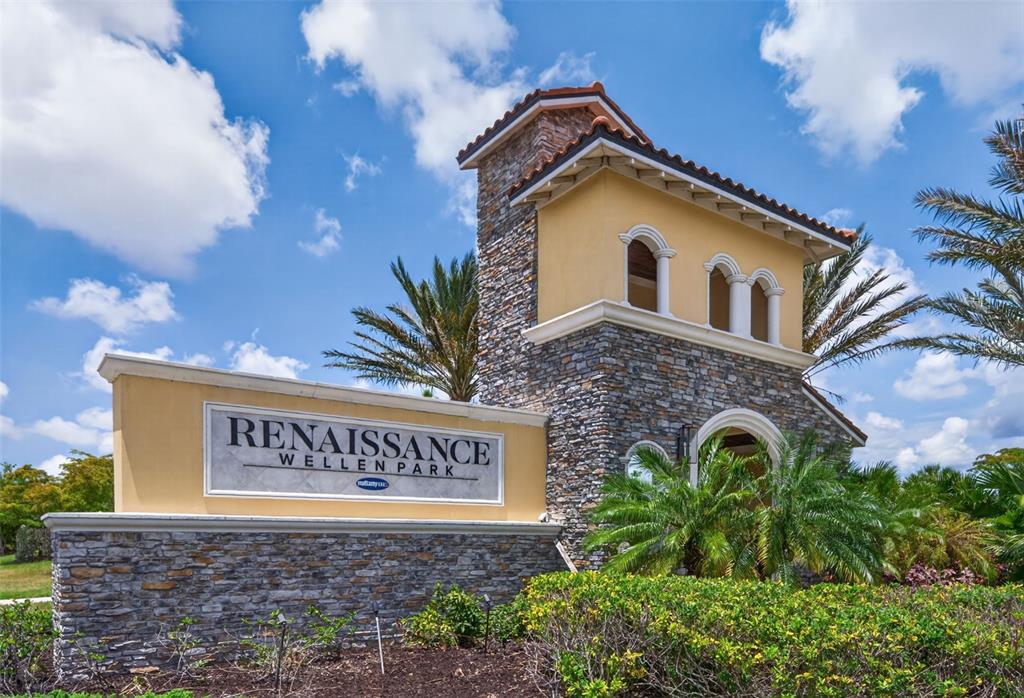 A stone and stucco monument sign marks the entrance to the Renaissance Wellen Park community — 20458 BANDERA PLACE, VENICE, FL