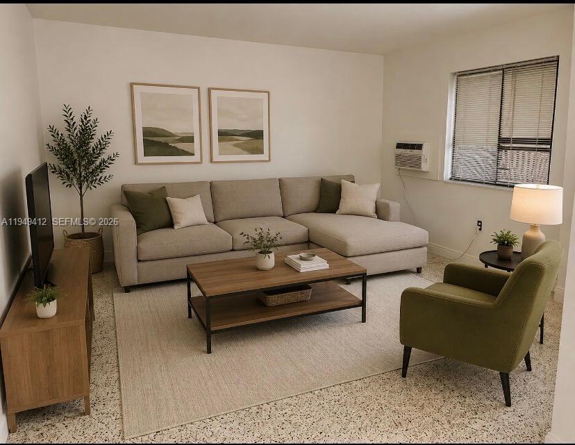 A living room features a beige sectional sofa, a wooden coffee table, and a green armchair — 626 NE 61st St # 5, Miami FL 33137, MIAMI, FL