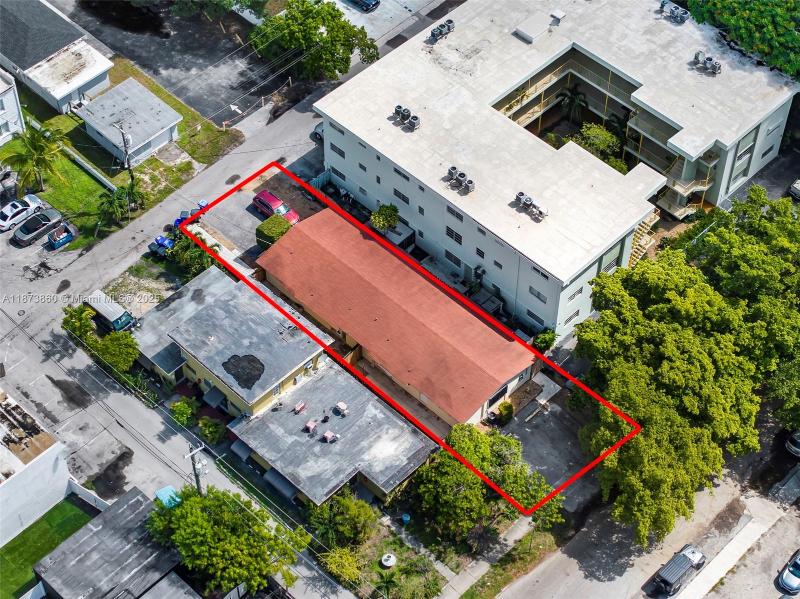 An aerial view shows a rectangular property with a red-roofed building outlined in red — 2033 Dewey St, Hollywood FL 33020, HOLLYWOOD, FL