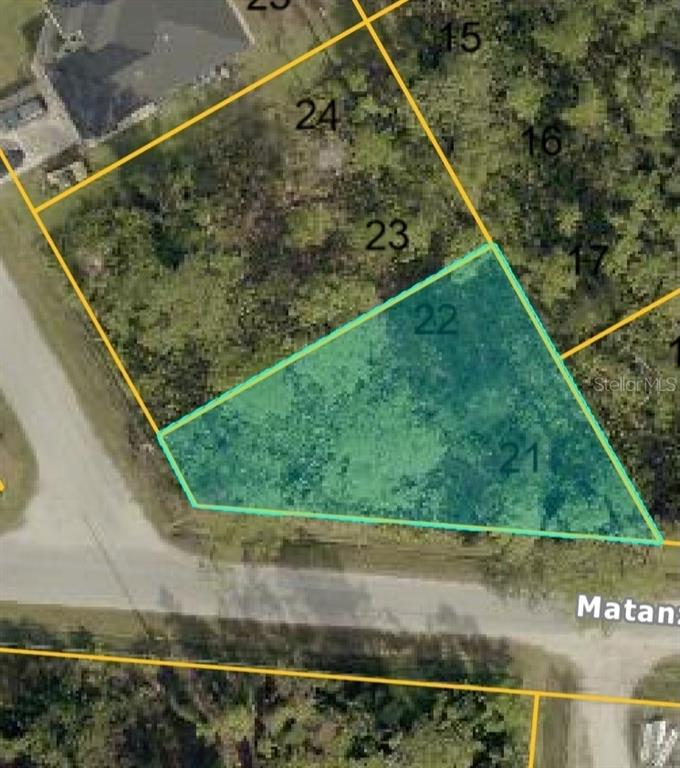 This is an aerial map view showing two highlighted adjacent land parcels — VESPUCIUS STREET, NORTH PORT, FL