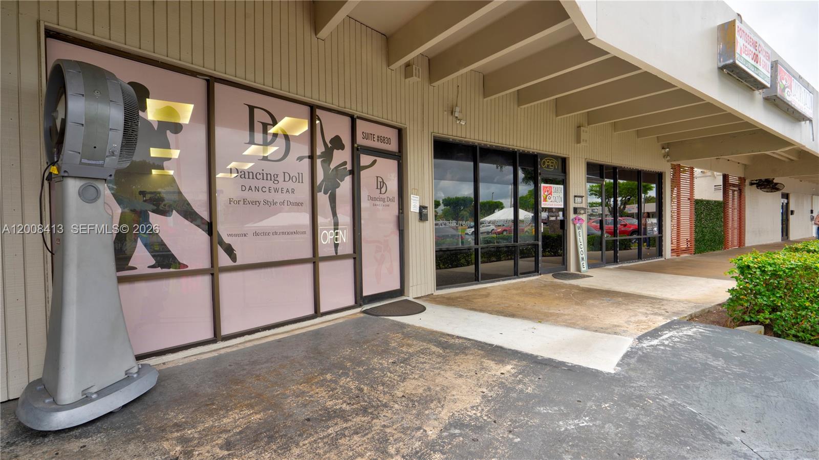 A storefront for a dancewear shop features a large industrial fan on the sidewalk — 68 169 ST, Hialeah FL 33015, HIALEAH, FL