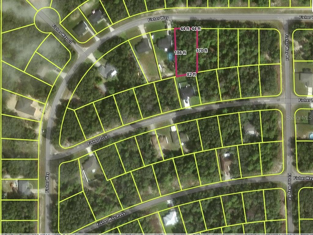An aerial map shows a highlighted rectangular residential lot outlined in pink among surrounding properties — TBD FISHER WAY, OCKLAWAHA, FL
