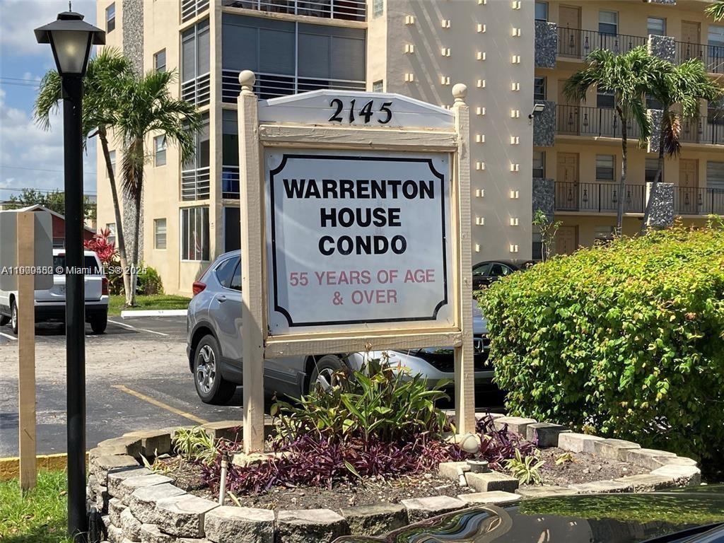 A sign for Warrenton House Condo stands in front of a multi-story residential building — 2145 Pierce St # 205, Hollywood FL 33020, HOLLYWOOD, FL