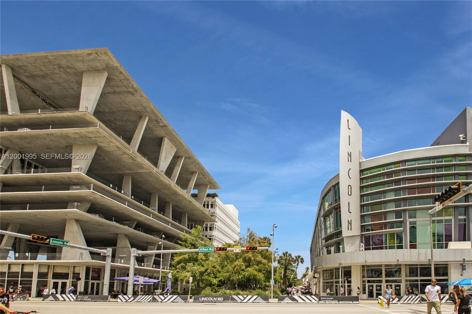 A street-level view shows a modern concrete parking garage and a commercial building on Lincoln Road — 1250 Lincoln Rd # 404, Miami Beach FL 33139, MIAMI BEACH, FL