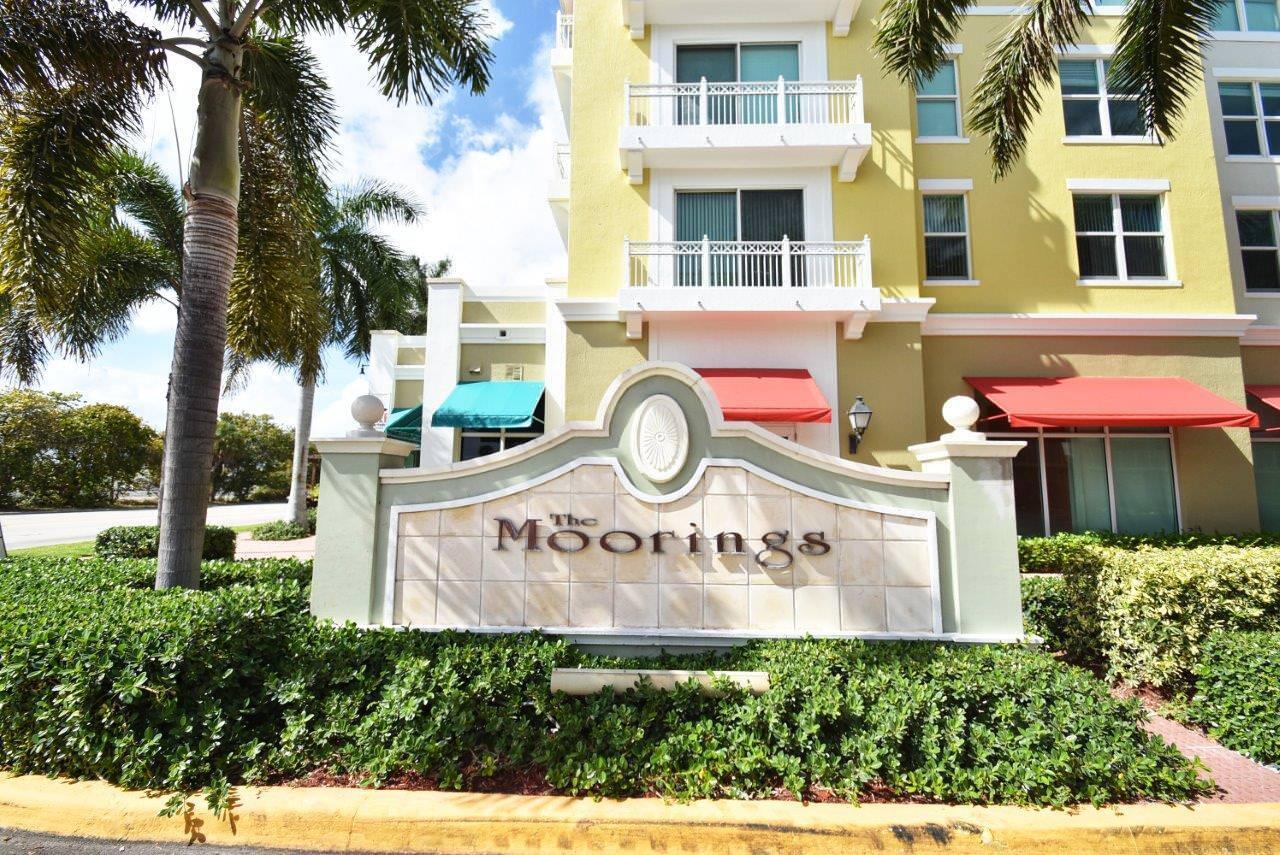 A sign for The Moorings stands in front of a multi-story yellow residential building — 802 W Windward Way # 304, Lantana FL 33462, LANTANA, FL