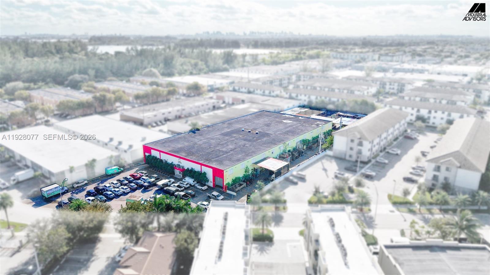 An aerial view shows a rectangular industrial building with a parking lot and surrounding structures — 290 W 78th Rd, Hialeah FL 33014, HIALEAH, FL