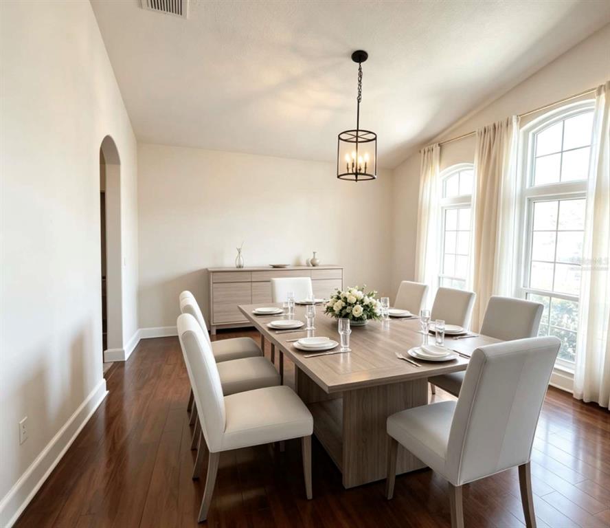 A dining room features a wooden table, six chairs, a sideboard, and a pendant light — 731 FORESTGREEN COURT, ORLANDO, FL
