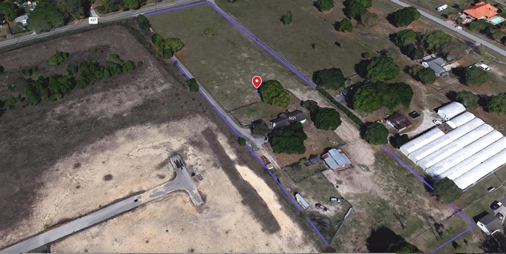 An aerial view shows a rectangular property with a house, outbuildings, and open land — 5221 PLYMOUTH SORRENTO ROAD, APOPKA, FL