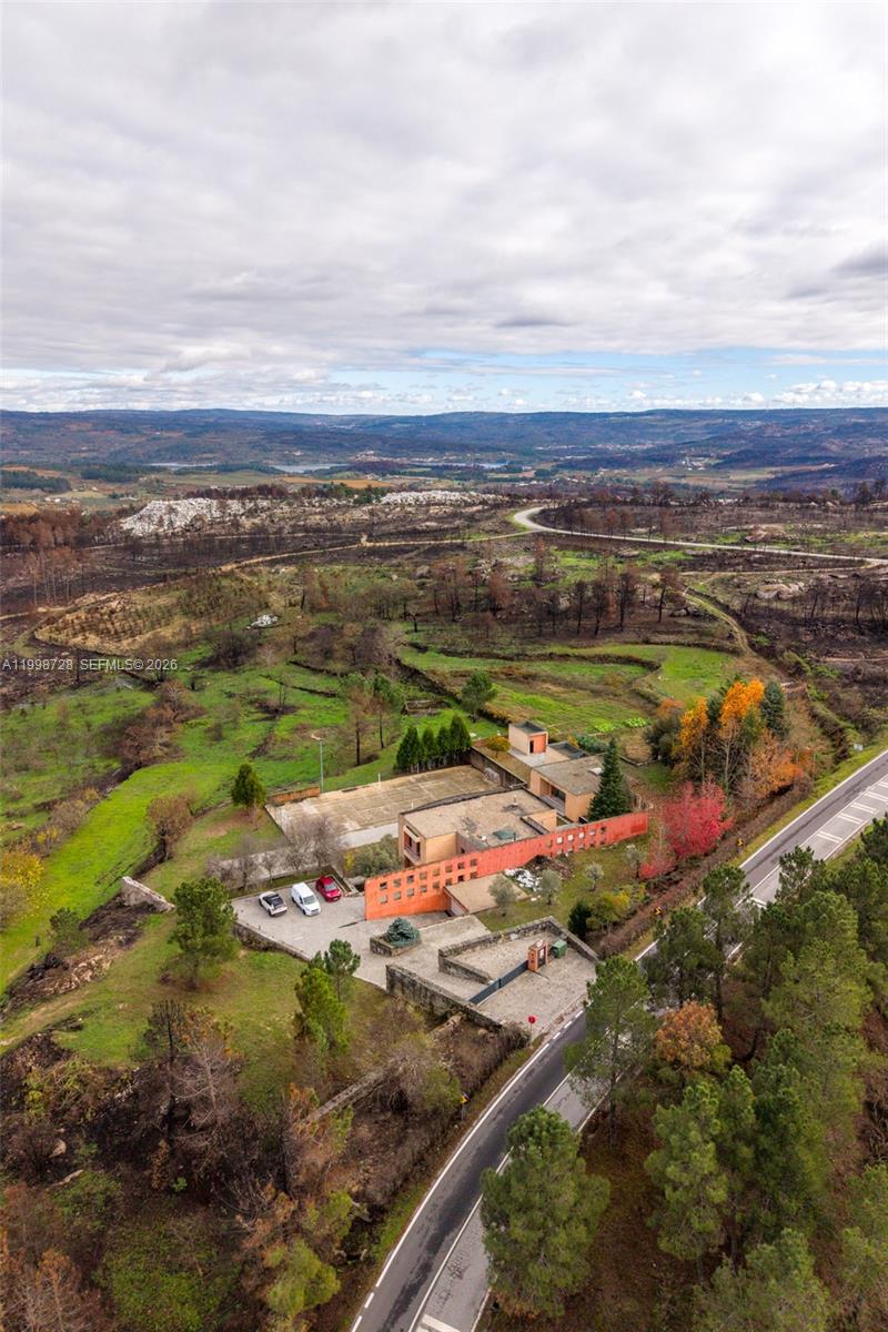 An aerial view shows a modern orange building with a flat roof and parking area — Numero 56 E Estrada Nacional 323,Moimenta da Beira, PT 3620, PT